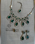 Scarlet Bridal Set which includes a necklace, earrings, and a tikka.